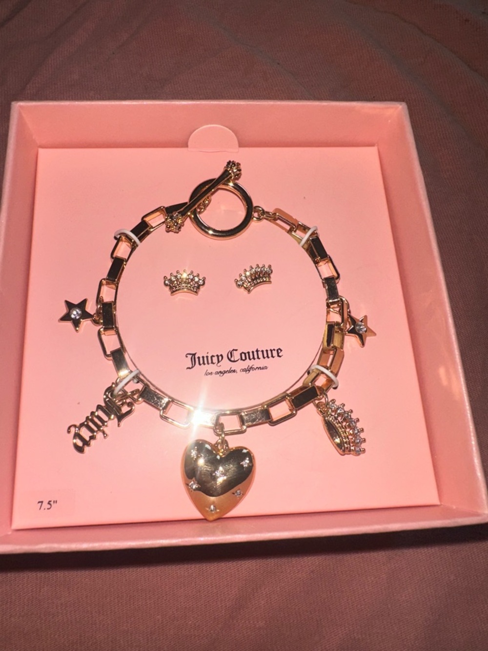 Juicy Couture Gold Charm Bracelet with Heart, Crown & Star Accents